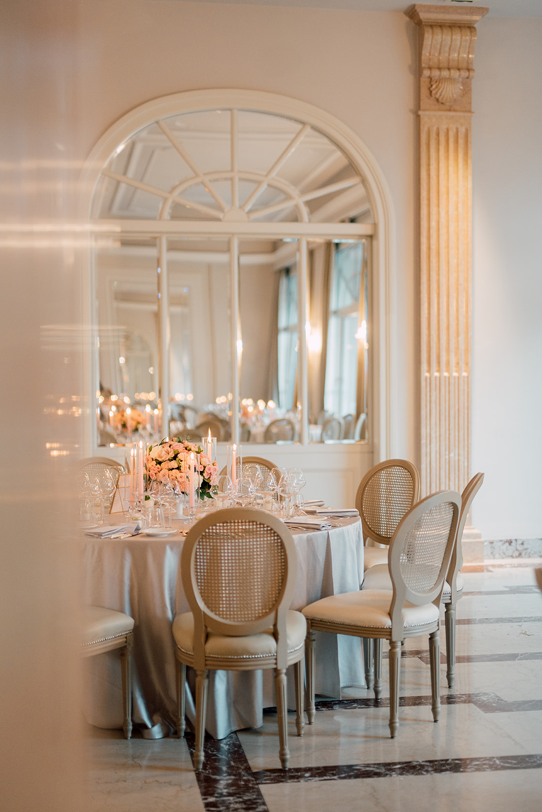 An elegant wedding reception table with flowers and candles